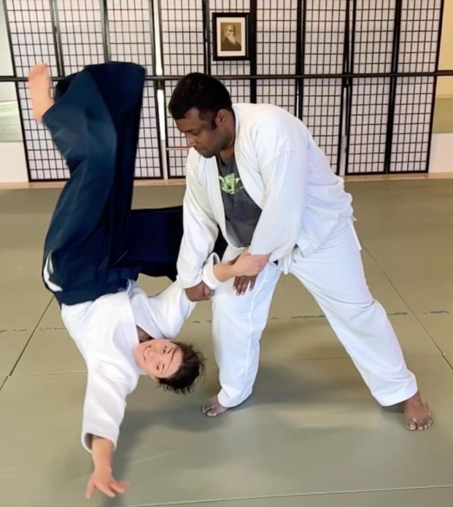 Evolene taking a high fall during Aikido practice at the dojo